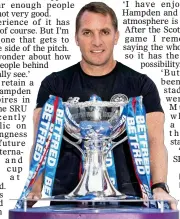  ??  ?? MOTIVATION: Rodgers with the cup that would be his fourth as Celtic manager