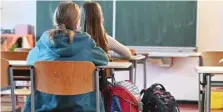  ?? — AFP ?? Students attend class at the Bruno H Buergel primary school in Berlin amid the novel coronaviru­s Covid-19 pandemic.