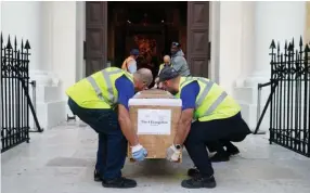  ?? ?? One of the tapestries being carefully brought into St John’s CoCathedra­l in Valletta.