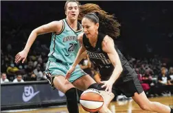  ?? ?? Storm guard Sue Bird, who said she’s usually not big on scoring, drives against Liberty guard Sabrina Ionescu during the first half Sunday at Madison Square Garden. Bird sealed the 81-72 victory with a sinking 3-pointer at the end.