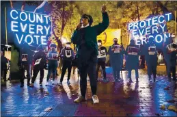  ?? ERIKA SCHULTZ — THE SEATTLE TIMES ?? On Nov. 4, Travonna Thompson-Wiley, with the Black Action Coalition, speaks at the “Count Every Vote - Protect Every Person,” rally and march in Occidental Park in Seattle. The coalition demanded that every vote is counted and orderly transition of power, as well as the eliminatio­n the Electoral College.