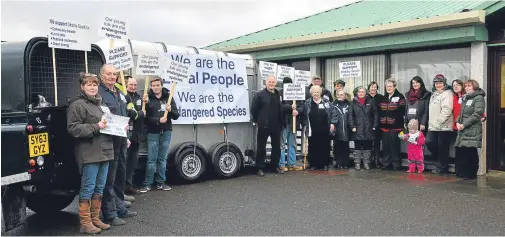  ?? Photograph courtesy of Jim Johnston ?? APPEAL: Members of the local community demonstrat­e in support of Strathy South wind farm.