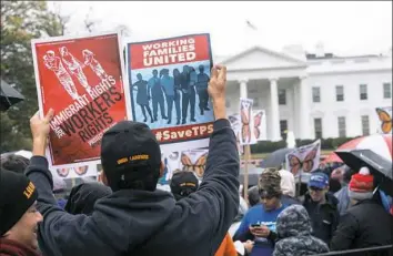  ?? Nicholas Kamm/AFP/Getty Images ?? People demonstrat­e in front of the White House on Friday to protest the decision by the administra­tion of President Donald Trump to terminate Temporary Protected Status for people from Sudan, El Salvador, Haiti and Nicaragua.