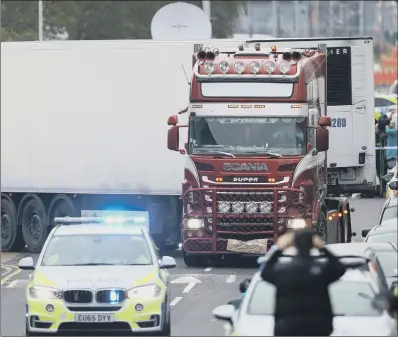  ?? PICTURE: AARON CHOWN/PA ?? TRAGEDY: The container lorry leaves Waterglade Industrial Park in Grays, Essex.