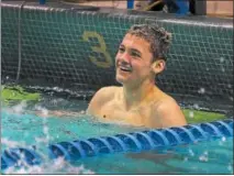  ?? DIGITAL FIRST MEDIA FILE PHOTO ?? North Penn’s Sean Faikish looks at his time after competing in the 500 Yard Freestyle during the District 1 boys swimming championsh­ip at La Salle University las season.