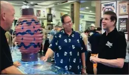  ??  ?? Joel gives Rick Harrison Details of Disneyland teacup prop on Recent Pawn Stars Episode.