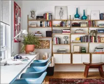  ?? ?? Jessica Davis turned to Ikea for midcentury modular shelving and desks on a budget in her home office, rounding out the space with some charming blue Eames-style chairs. The sustainabl­e cork flooring, which carries on into the kids’ bedrooms, adds some softness underfoot.