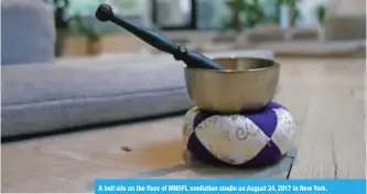  ??  ?? A bell sits on the floor of MNDFL mediation studio on August 24, 2017 in New York.