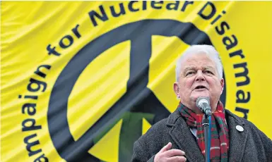  ?? ?? Kent at a CND rally in Trafalgar Square in 2016 and, below, in 1983: he transforme­d the fortunes of CND in the 1980s, until the end of the Cold War, and left the priesthood to concentrat­e on campaignin­g