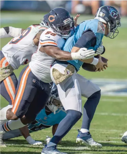  ?? JOE HOWELL/ AP ?? Bears inside linebacker Roquan Smith sacks Titans quarterbac­k Ryan Tannehill last Sunday in Nashville, Tenn.