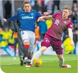  ??  ?? Rangers’ James Tavernier, left, and Saints’ Blair Alston in a tussle