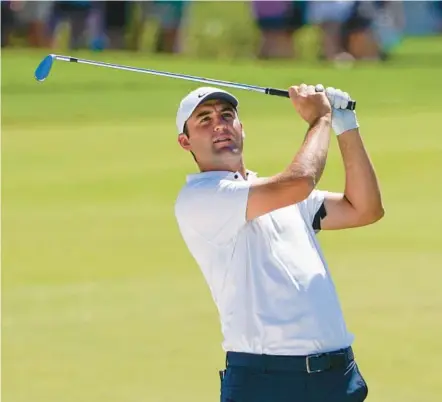  ?? JOHN RAOUX/AP ?? Scottie Scheffler hits from the fairway en route to victory during the 2022 Arnold Palmer Invitation­al in Orlando.