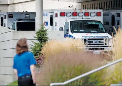  ?? AP PHOTO ?? Ambulances line up in the emergency area of Sacred Heart Hospital following reports of a shooting at Freeman High School on Wednesday.