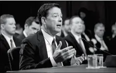  ?? ASSOCIATED PRESS ?? FORMER FBI DIRECTOR JAMES COMEY recounts a series of conversati­ons with President Donald Trump as he testifies before the Senate Select Committee on Intelligen­ce on Capitol Hill in Washington on Thursday.