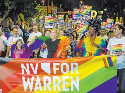  ?? L.E. Baskow Las Vegas Review-journal @Left_eye_images ?? Democratic presidenti­al candidate Sen. Elizabeth Warren, D-mass., participat­es in the Las Vegas Pride Night Parade on Friday.