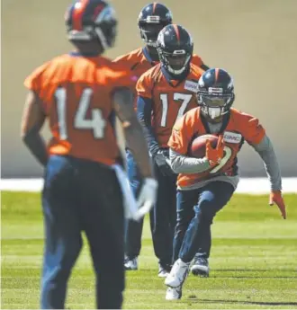  ?? Helen H. Richardson, Denver Post file ?? Kalif Raymond, shown running with the ball during a drill in the spring, is in the hunt to make the Broncos as a wide receiver. The position is in flux because of the uncertain timetable for the return of rookie Carlos Henderson.