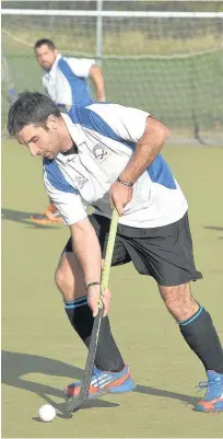  ?? Gw-images.com ?? Midfielder Joe Cooper ( and striker Pete Jones battled but were unable to prevent Runcorn Hockey Club’s men’s first-team losing out to Alderley Edge last Saturday.