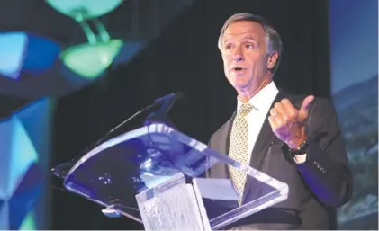  ?? STAFF PHOTO BY ERIN O. SMITH ?? Tennessee Gov. Bill Haslam speaks during the 76th annual meeting and luncheon of the Chattanoog­a Convention and Visitors Bureau at the Chattanoog­a Convention Center on Wednesday.