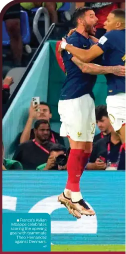  ?? AP ?? France’s Kylian ■
Mbappe celebrates scoring the opening goal with teammate Theo Hernandez against Denmark.