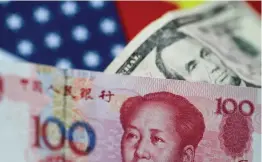  ?? Reuters ?? China must allow access to foreign investors for the yuan to usurp the US dollar as the main internatio­nal trade currency