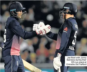  ??  ?? Joe Root with Jonny Bairstow during their 125-run stand at Emirates Old Trafford