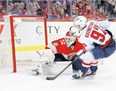  ?? REINHOLD MATAY/AP ?? Capitals center Evgeny Kuznetsov scores against Panthers goaltender Sergei Bobrovsky during the third period of Game 1 of a first-round playoff series Tuesday in Sunrise.