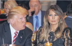  ?? AFP ?? US President Donald Trump and US First Lady Melania Trump sit down for Thanksgivi­ng dinner at his Mar-a-Lago resort in Palm Beach, Florida.