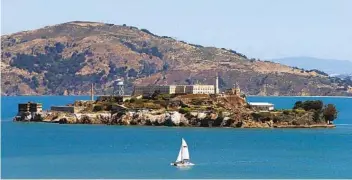  ?? MARK BOSTER LOS ANGELES TIMES ?? A boat sails past Alcatraz on a sunny day. The attraction reopened in March for limited numbers of visitors.