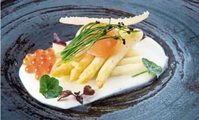  ??  ?? White asparagus and smoked tofu with onsen egg yolk from Elements.