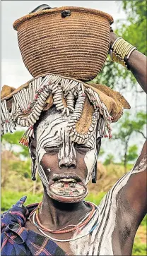  ??  ?? ANCIENT ADORNMENT: A Mursi woman with a lip plate