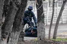  ?? Vasily Krestyanin­ov / Associated Press ?? A police officer detains a protester Saturday after clashes in Almaty, Kazakhstan. Kazakhstan’s president authorized security forces to shoot to kill those participat­ing in unrest.