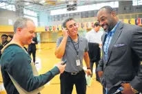  ?? GARY MIDDENDORF/DAILY SOUTHTOWN ?? Daily Southtown columnist Pat Disabato, center, interviews Mount Carmel graduate and former NFL quarterbac­k Donovan McNabb on May 18, 2016.