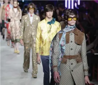  ?? ANTONIO CALANNI/THE ASSOCIATED PRESS ?? Models wear creations for Gucci men’s spring-summer 2016 collection, part of Milan Fashion Week, unveiled on Monday.