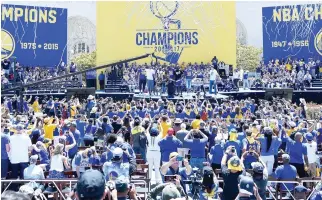  ??  ?? The Golden State Warriors celebrate their 2017 NBA Championsh­ip at The Henry J. Kaiser Convention Center during their victory parade and rally in Oakland, California, on Thursday. (AFP)