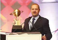  ??  ?? Dan Mohnke, senior vice president, sales and marketing, Nissan America, accepts the World Green Car award