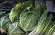  ?? J. SCOTT APPLEWHITE — THE ASSOCIATED PRESS FILE ?? Savoy cabbage is displayed with summer fruits and vegetables at a farmers market in Falls Church, Va.