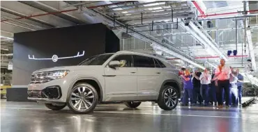  ?? STAFF FILE PHOTO BY C.B. SCHMELTER ?? A 2020 Atlas Cross Sport is driven out at the Volkswagen assembly plant in Chattanoog­a late last year. The five-seat SUV, which takes design cues from seven-seat Atlas, hit dealership­s early this year.