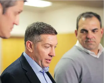  ??  ?? Sheldon Kennedy, centre, and his former Swift Current Broncos teammates Peter Soberlak, left, and Bob Wilkie talk to reporters in Saskatoon after meeting with Humboldt Broncos crash survivors and family members.