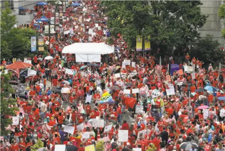  ?? Gerry Broome / Associated Press ?? Teachers fill Bicentenni­al Plaza during a rally for raises and resources Wednesday at the General Assembly in Raleigh, N.C.