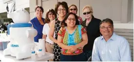  ??  ?? Agents and staff at the MTSIR Memorial office took the heat off a recent festival with free snow cones.