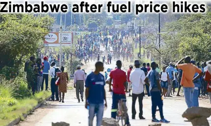  ?? AP ?? Protesters gather on a street during a demonstrat­ion over the hike in fuel prices in Harare, Zimbabwe yesterday.