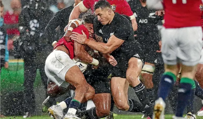  ?? ANTHONY AU-YEUNG/GETTY IMAGES ?? Sonny Bill Williams hits Anthony Watson with a high tackle during the second test against the British and Irish Lions.