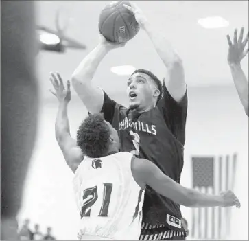  ?? Gary Coronado Los Angeles Times ?? LIANGELO BALL of Chino Hills puts up a shot over Damien’s Warren Bryan during their game Friday in LaVerne. Ball had 52 points, including 10 three-pointers, as Chino Hills won for the 57th consecutiv­e time.