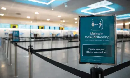  ??  ?? Deserted check-in desks and passenger facilities at Gatwick. Photograph: Leon Neal/Getty Images