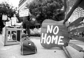  ?? JUAN FIGUEROA/DALLAS MORNING NEWS ?? Protesters place furniture outside the office of Texas Sen. John Cornyn during an rally last September.