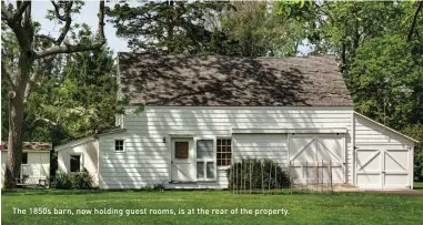  ??  ?? The 1850s barn, now holding guest rooms, is at the rear of the property.