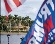  ?? ANDREW HARNIK — THE ASSOCIATED PRESS ?? Flags in support of former President Donald Trump fly outside his Mar-a-lago resort, Tuesday, Nov. 15, in Palm Beach, Fla.