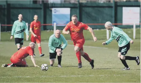  ??  ?? Seaton Buildings Over-40s (red) in action against Boldon Colliery Old Barrel, played at Seaham Town Park.