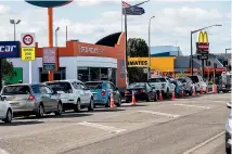  ?? DAVID UNWIN/STUFF ?? Times may change, but human behaviour doesn’t. Witness the queues for McDonald’s in Palmerston North on Tuesday.