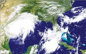  ?? NASA/NOAA/AFP ?? Hurricane Harvey (left) approaches the coast of Texas on Friday.